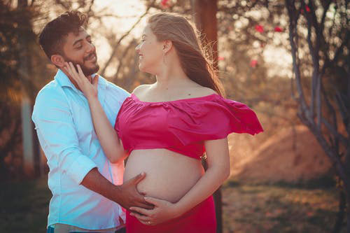 Pregnant woman and her partner.